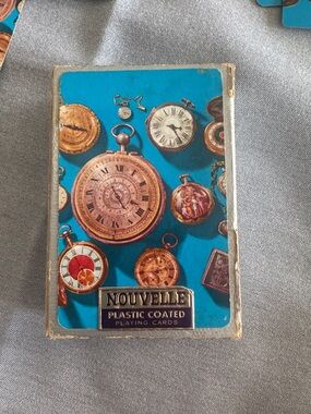 Vintage Nouvelle pocket watch plastic covered playing cards.